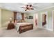 Bedroom with ceiling fan, natural light, and en suite access at 806 S Second St, Smithfield, NC 27577