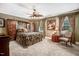 Spacious bedroom featuring a ceiling fan, large windows, and built-in wardrobe at 806 S Second St, Smithfield, NC 27577