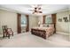 Comfortable bedroom featuring a ceiling fan, natural light, and classic decor at 806 S Second St, Smithfield, NC 27577