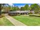 Beautiful single story brick home with a well-maintained lawn and manicured landscaping at 806 S Second St, Smithfield, NC 27577