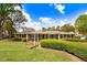 Charming brick home with manicured lawn, trimmed hedges, and classic architectural details under a sunny sky at 806 S Second St, Smithfield, NC 27577