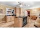 Well-lit kitchen featuring a center island, wood cabinets, and stylish flooring at 806 S Second St, Smithfield, NC 27577