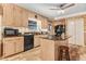 Kitchen featuring a center island, granite countertops, and black appliances at 806 S Second St, Smithfield, NC 27577