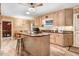 Bright kitchen with granite countertops, a center island, and wood cabinetry at 806 S Second St, Smithfield, NC 27577