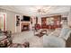 Retro-style living room with brick fireplace, custom built-ins, and plush seating at 806 S Second St, Smithfield, NC 27577