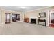 Bright living room features a decorative fireplace and a seamless flow to the dining area at 806 S Second St, Smithfield, NC 27577