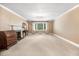 Spacious living room featuring large windows and a classic fireplace with decorative mantle at 806 S Second St, Smithfield, NC 27577