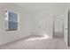 Bright bedroom featuring a window, double door closet and neutral carpeting at 833 Kenyon Spring Dr, Zebulon, NC 27597