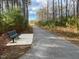 Walking trail with park bench surrounded by nature at 833 Kenyon Spring Dr, Zebulon, NC 27597
