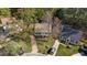 Aerial view of home featuring mature trees, a well-maintained lawn, and a private driveway at 8333 Bellingham Cir, Raleigh, NC 27615