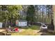 Private backyard with a shed, patio, garden, and mature trees at 8333 Bellingham Cir, Raleigh, NC 27615