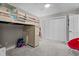 A bedroom with a built-in loft bed, dresser, ceiling fan, and ample space at 8333 Bellingham Cir, Raleigh, NC 27615