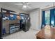 Charming bedroom features a built-in loft bed, desk, ceiling fan and window with stylish blue curtains at 8333 Bellingham Cir, Raleigh, NC 27615