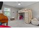Bright room featuring a loft bed and storage underneath, a window, and ample space at 8333 Bellingham Cir, Raleigh, NC 27615