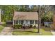 Classic home with tidy front yard, brick chimney, and a neatly landscaped entrance at 8333 Bellingham Cir, Raleigh, NC 27615