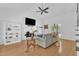 Spacious living room with hardwood floors, fireplace, built-in bookshelves, and neutral color palette at 8721 Attingham Dr, Raleigh, NC 27615