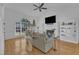 Bright living room with hardwood floors, a fireplace, vaulted ceiling, and natural light at 8721 Attingham Dr, Raleigh, NC 27615