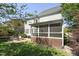 Charming backyard patio with screened porch, perfect for outdoor entertaining and relaxation at 904 Coral Bell Dr, Wake Forest, NC 27587