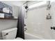 Bathroom featuring a shower and tub with gray shower curtain and shelving at 904 Coral Bell Dr, Wake Forest, NC 27587