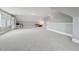 Large bonus room with carpet flooring, natural light, and ample space for activities at 904 Coral Bell Dr, Wake Forest, NC 27587