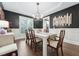 Elegant dining room with dark walls and hardwood floors at 904 Coral Bell Dr, Wake Forest, NC 27587