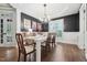 Elegant dining room with dark walls and hardwood floors at 904 Coral Bell Dr, Wake Forest, NC 27587
