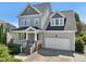 Charming two-story home with a covered front porch and attached two-car garage at 904 Coral Bell Dr, Wake Forest, NC 27587