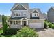 Charming two-story home with a covered front porch and attached two-car garage at 904 Coral Bell Dr, Wake Forest, NC 27587