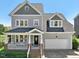 Charming two-story home with a covered front porch and attached two-car garage at 904 Coral Bell Dr, Wake Forest, NC 27587