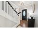 Inviting foyer with hardwood floors and staircase at 904 Coral Bell Dr, Wake Forest, NC 27587