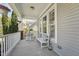 Inviting front porch with rocking chair and bench seating at 904 Coral Bell Dr, Wake Forest, NC 27587