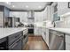 Contemporary kitchen with stainless steel appliances, granite countertops, and ample cabinet space, perfect for culinary enthusiasts at 904 Coral Bell Dr, Wake Forest, NC 27587