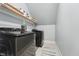 Laundry room featuring front load washer and dryer with storage shelf at 904 Coral Bell Dr, Wake Forest, NC 27587
