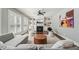 Bright living room features a fireplace, custom built-ins, ceiling fan and hardwood floors at 904 Coral Bell Dr, Wake Forest, NC 27587