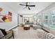 Living room with fireplace, hardwood floors and view of the modern kitchen at 904 Coral Bell Dr, Wake Forest, NC 27587