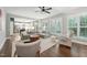 Cozy living room with hardwood floors, fireplace, ceiling fan and a kitchen view at 904 Coral Bell Dr, Wake Forest, NC 27587