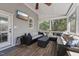 Relaxing screened-in porch with comfortable seating, ceiling fan, and natural light for enjoying outdoor living at 904 Coral Bell Dr, Wake Forest, NC 27587
