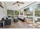 Inviting screened-in porch with outdoor furniture, ceiling fan, and views of the backyard, creating a relaxing retreat at 904 Coral Bell Dr, Wake Forest, NC 27587