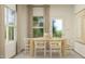 Cozy dining room featuring light wood table and chairs, with natural light and simple decor at 92 Glencoe Ln, Zebulon, NC 27597