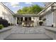 Expansive back patio with outdoor dining set, accessible from inside the home through sliding glass doors at 1001 Manchester Dr, Raleigh, NC 27609