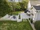 Aerial view of backyard featuring patio, firepit, and dining areas at 1001 Manchester Dr, Raleigh, NC 27609
