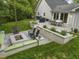 Landscaped backyard featuring a patio, fire pit, built-in benches, and a dining area at 1001 Manchester Dr, Raleigh, NC 27609