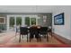 Open dining room featuring a modern light fixture and view of the backyard at 1001 Manchester Dr, Raleigh, NC 27609