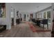 Spacious dining room with hardwood floors, large windows and modern light fixture at 1001 Manchester Dr, Raleigh, NC 27609