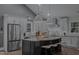 Modern kitchen with stainless steel appliances, granite countertops, and a large island at 1001 Manchester Dr, Raleigh, NC 27609