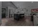 Well-appointed kitchen with a stainless steel refrigerator, an island, and modern lighting at 1001 Manchester Dr, Raleigh, NC 27609