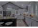Stylish kitchen featuring stainless appliances, a large island, and an open layout to the living area at 1001 Manchester Dr, Raleigh, NC 27609