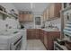 Functional laundry room with cabinetry, countertop space, and modern washer and dryer at 1001 Manchester Dr, Raleigh, NC 27609