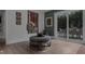 Cozy sitting area with an ottoman and sliding glass doors to the backyard at 1001 Manchester Dr, Raleigh, NC 27609