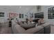 Comfortable living room boasts vaulted ceilings, expansive windows, and a large sectional sofa at 1001 Manchester Dr, Raleigh, NC 27609